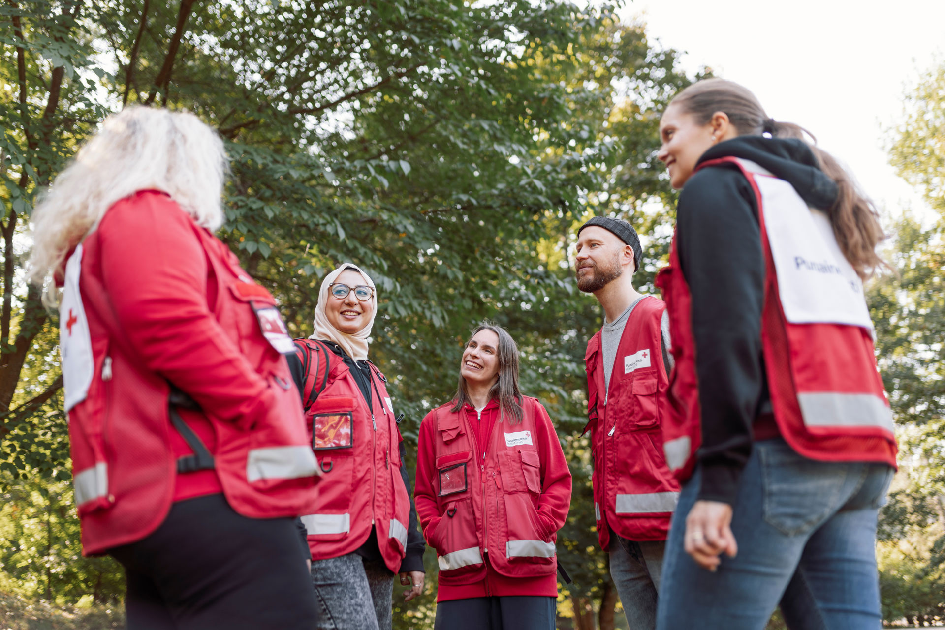 Red Cross volunteers go through a check-out round talk after the task.